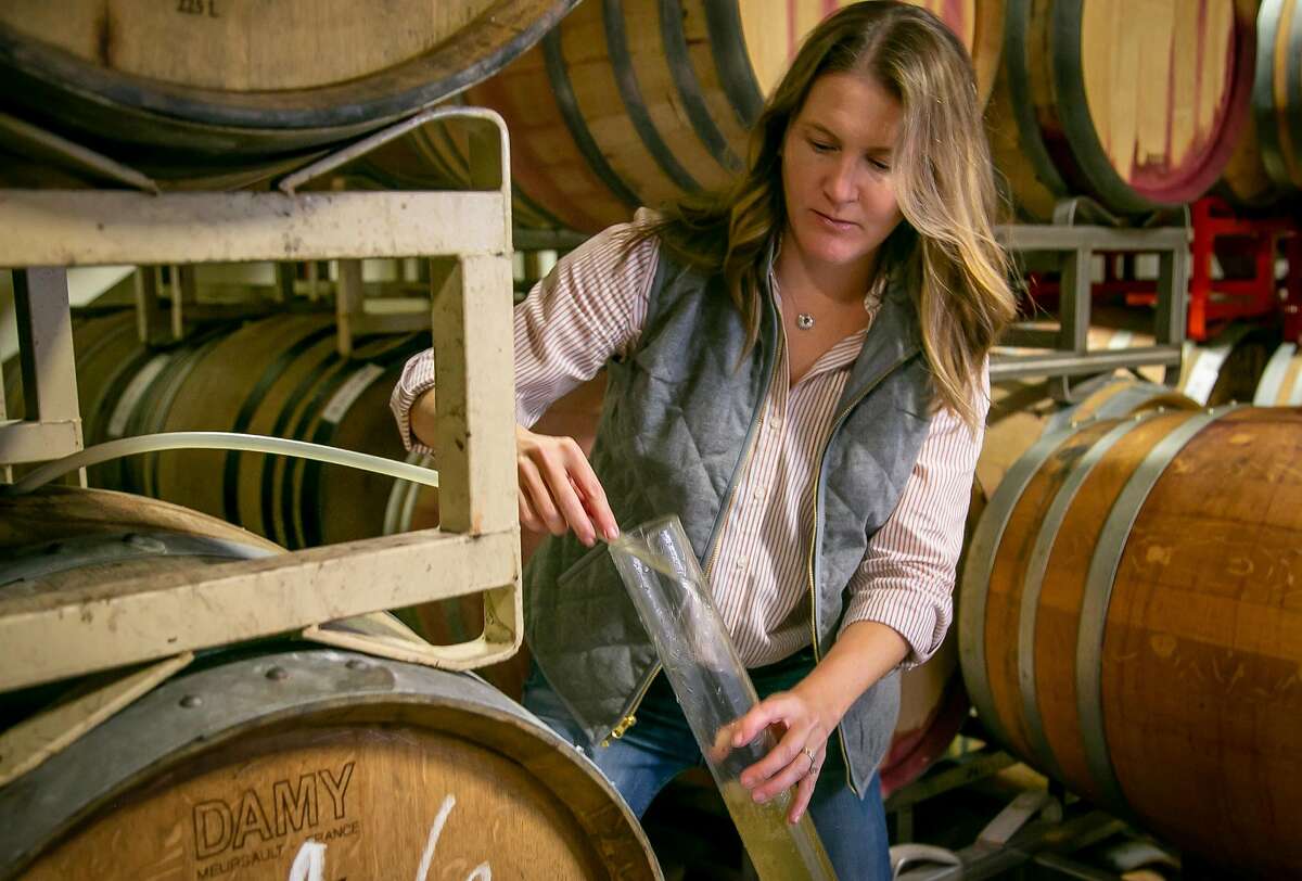 Winemaker Mandy Heldt Donovan pulls the 2018 Pinot Gris from the barrel at her custom crush winery in Sonoma, Calif. on November 30th, 2018.