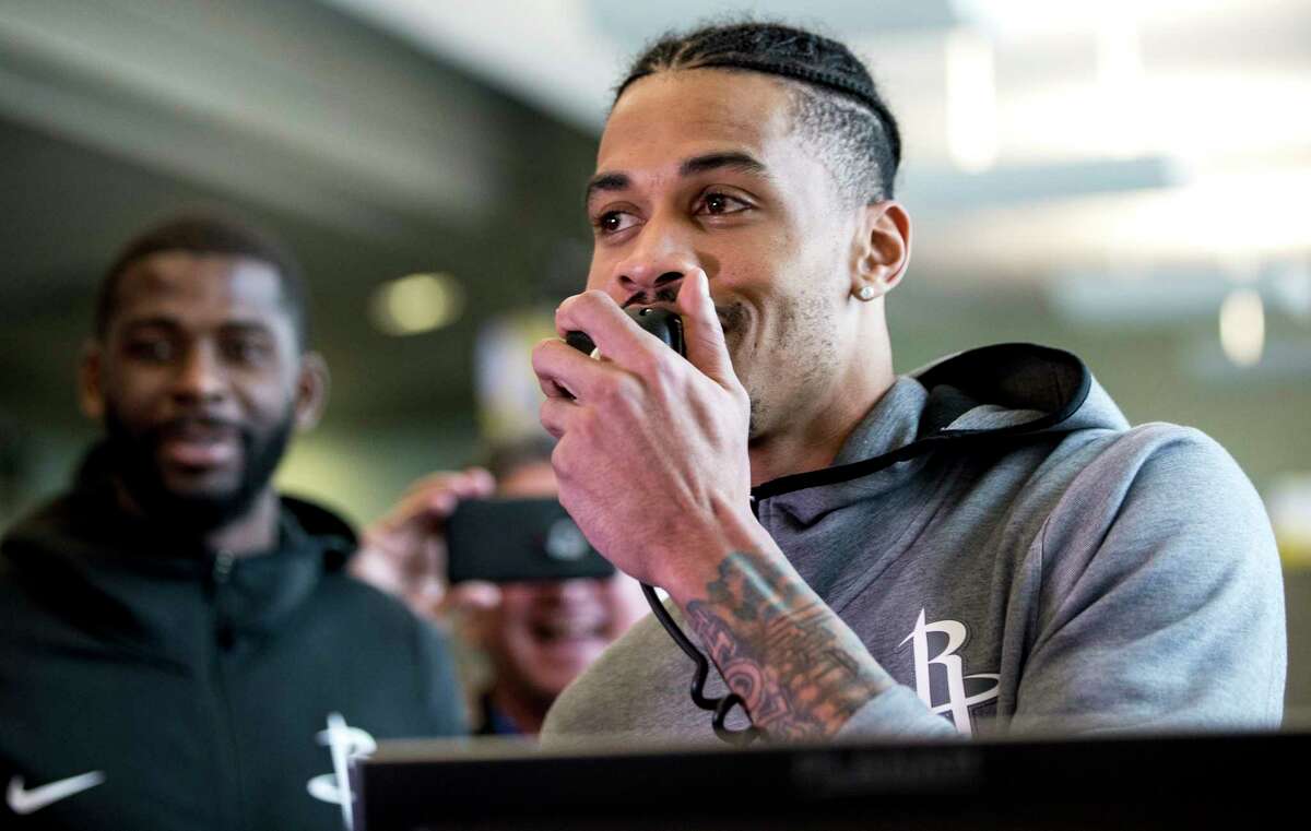 Houston Rockets guard Gerald Green makes a flight boarding announcement for a Southwest Airines flight at William P. Hobby Airport on Tuesday, Jan. 15, 2019, in Houston. The Rockets players teamed up with Southwest Airlines to surprise travelers at Hobby Airport. Southwest employees joined the players, Clutch the Bear, and members of the Rockets Power Dancers in greeting and interacting with customers at the airport while helping to perform duties such as announcing flight information and collecting boarding passes.